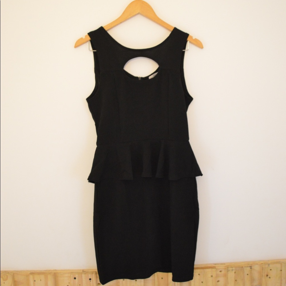 Cute black peplum bodycon dress with oval cut out